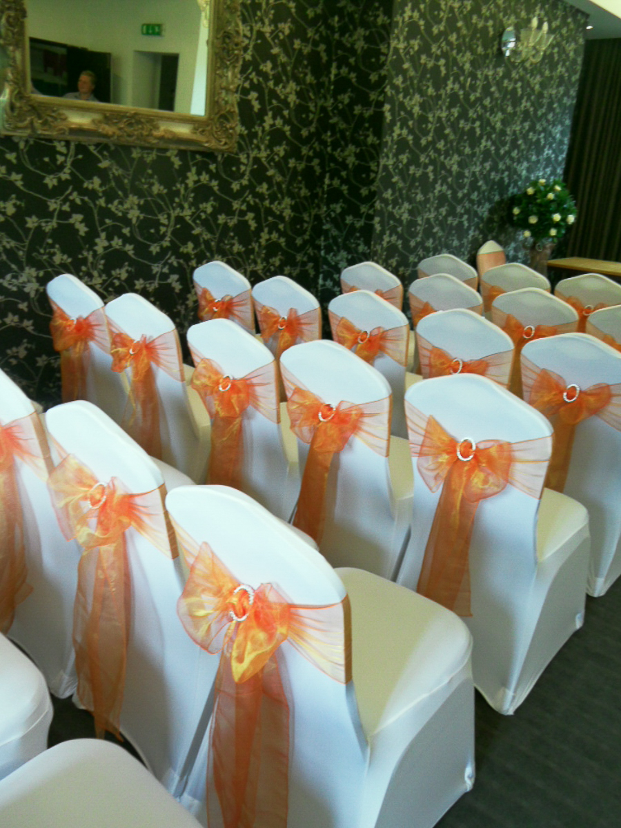 Orange and chocolate chair styling at The Limes